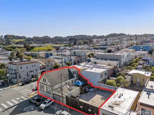 a view of city from balcony with outdoor seating