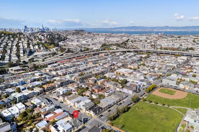 a large white house with a yard