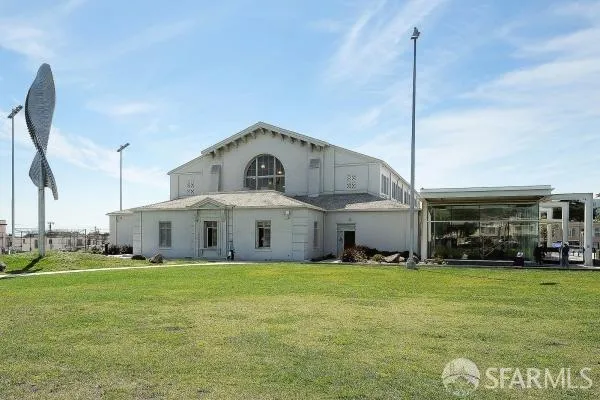 a view of a lake with houses in the back