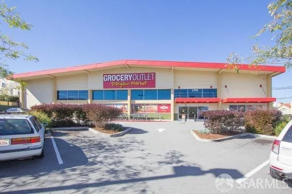 a front view of a building with parking