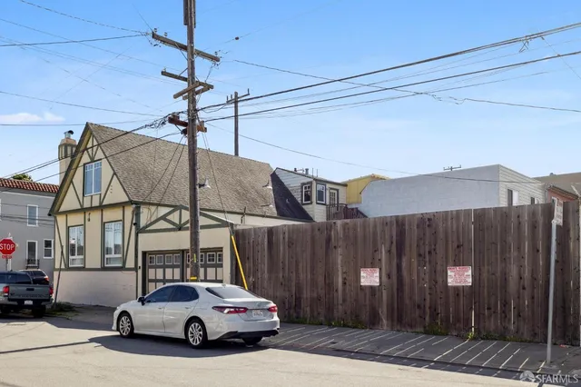 an aerial view of a city with streets and houses