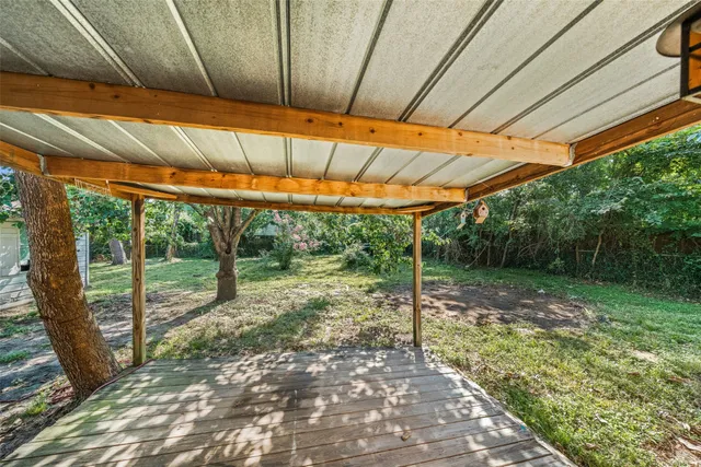 a backyard of a house with lots of garden