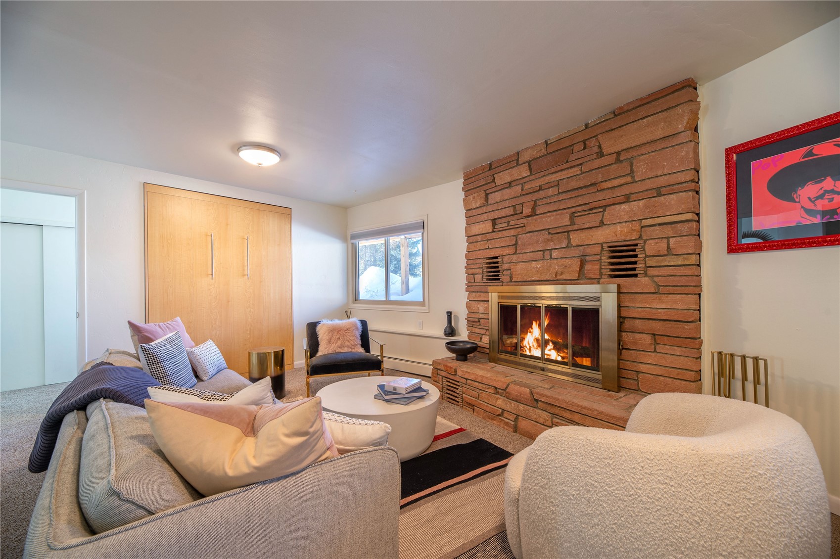 340 Buffalo Street Dillon, CO 80435 - Photo 23 of 40 a living room with furniture and a fireplace