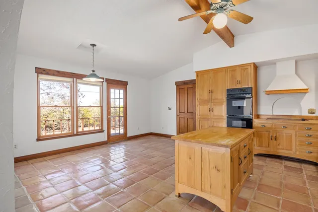 a view of a kitchen with furniture and window