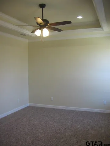 a view of a chandelier fan in a room