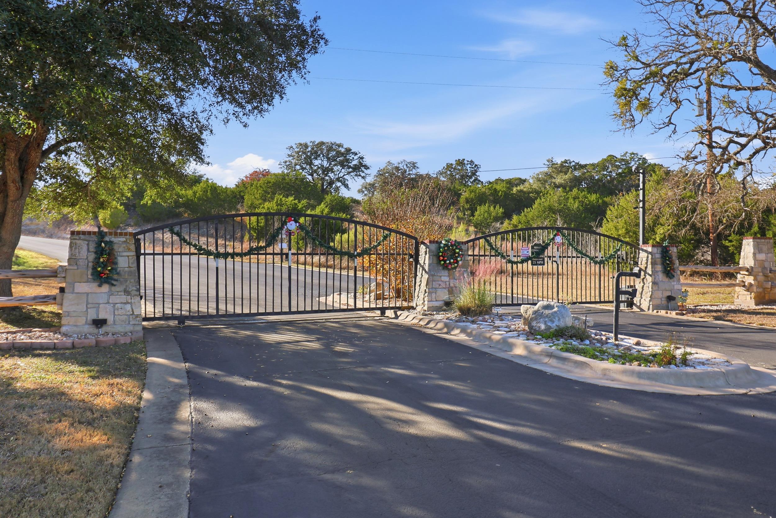 29910 Montana Ridge Pass Marble Falls, TX 78654 - Photo 20 of 24 a view of a street with a bench and trees around