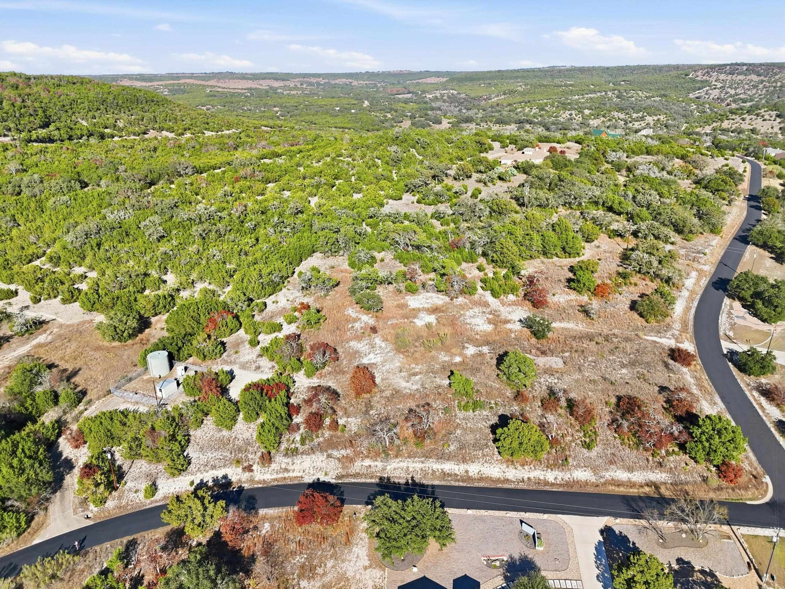 29910 Montana Ridge Pass Marble Falls, TX 78654 - Photo 3 of 24 an aerial view of residential houses with outdoor space