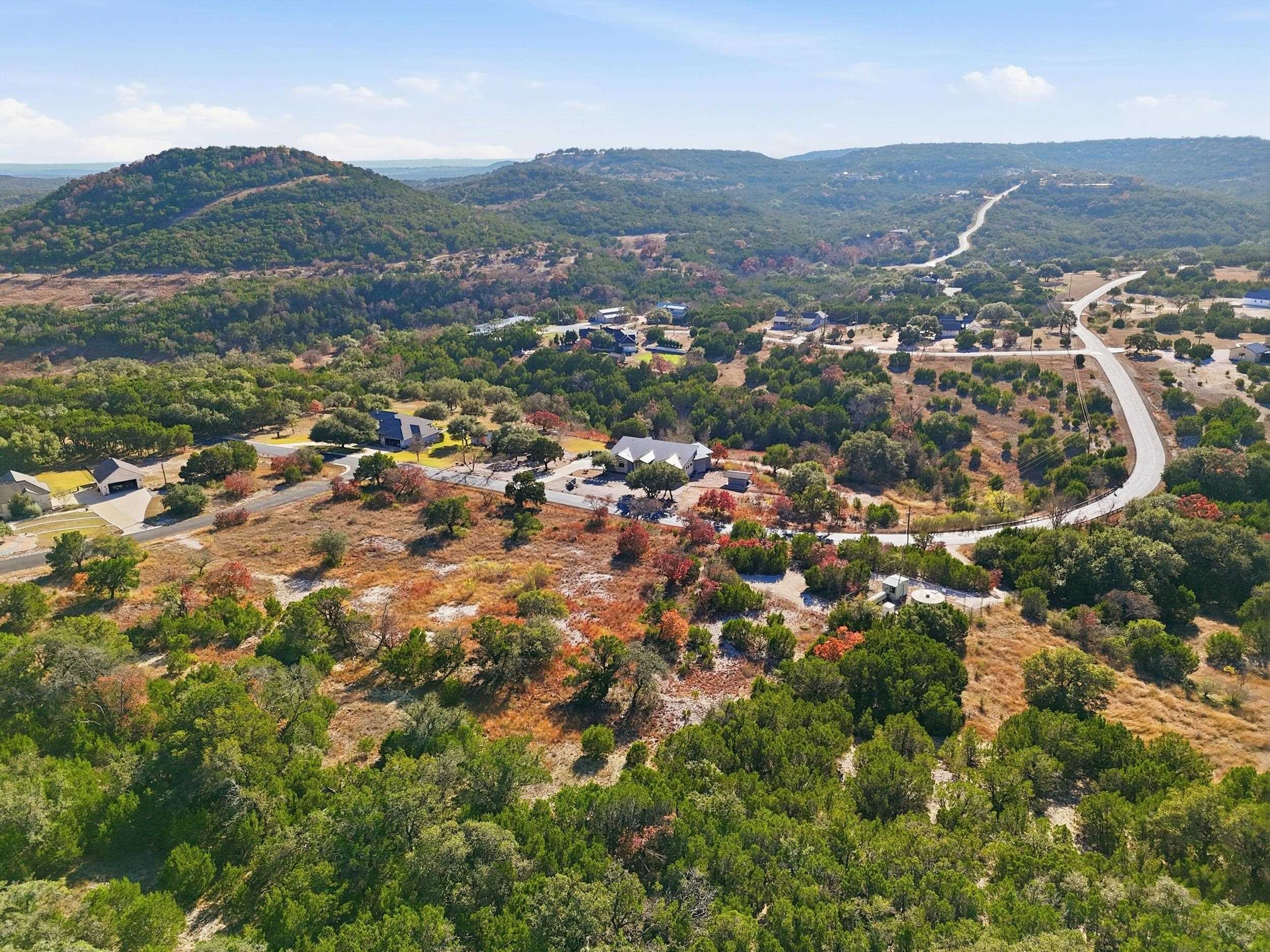 29910 Montana Ridge Pass Marble Falls, TX 78654 - Photo 7 of 24 an aerial view of residential houses with outdoor space and trees