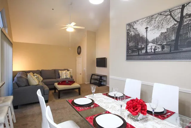 a living room with furniture and a table