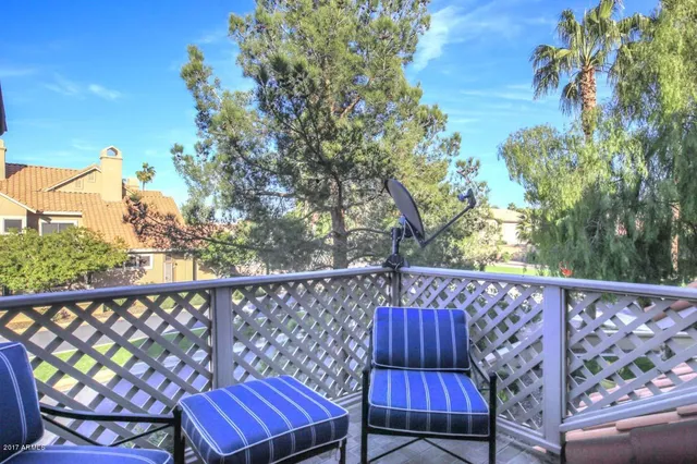 a view of a two chairs in the roof deck