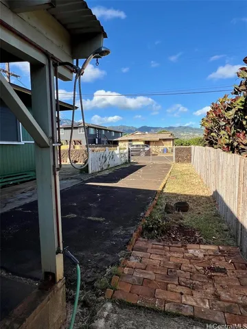 a view of a house with a snow in the yard