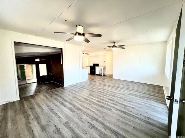 a large white kitchen with sink stove and refrigerator