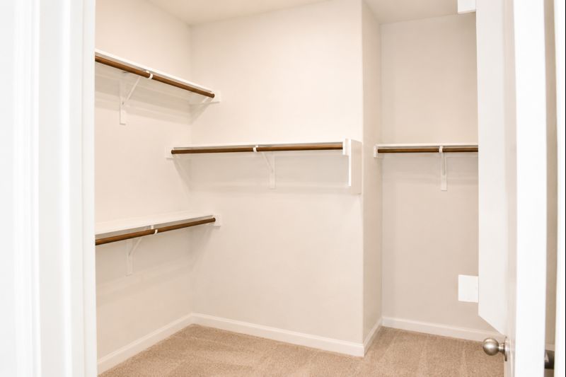 693 Durian Loop Buda, TX 78610 - Photo 17 of 27 Ample shelving and hanging space defines this highly functional, well-appointed closet.