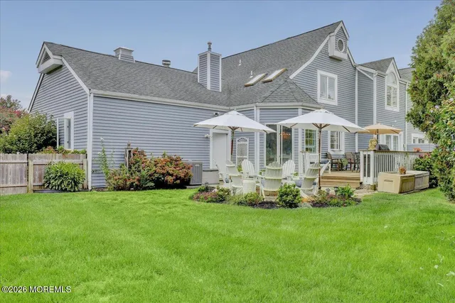 a view of backyard with seating and green space
