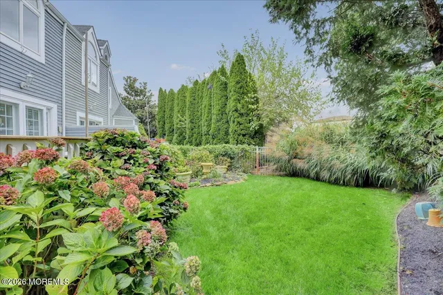 a view of a table and chairs under an umbrella