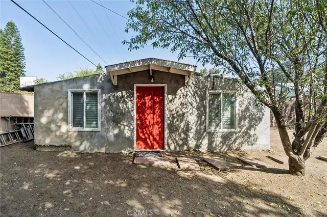 a house with trees in front of it