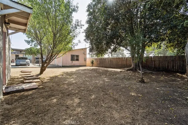 a view of a yard covered in snow