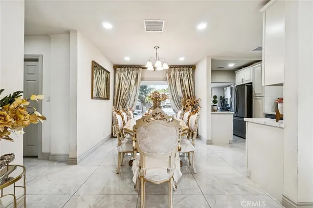 a view of a a dining room with furniture window and outside view