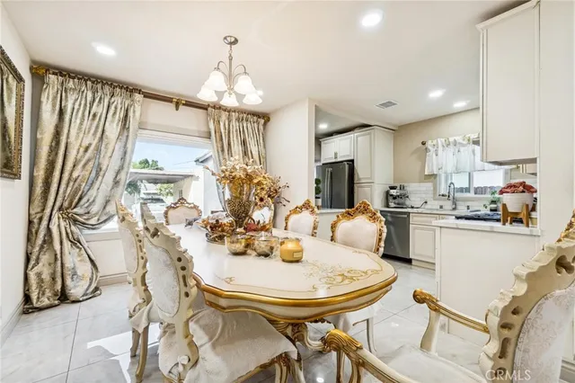 a kitchen with a table and chairs in it
