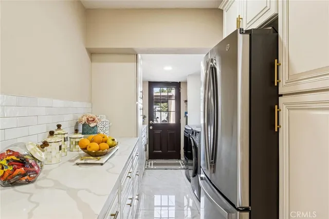 a bedroom with a bed and glass door