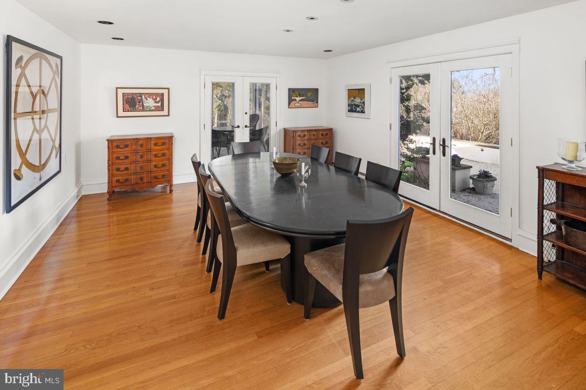 145 East Bells Mill Road Philadelphia, PA 19118 - Photo 14 of 38 a view of a dining room with furniture and a wooden floor