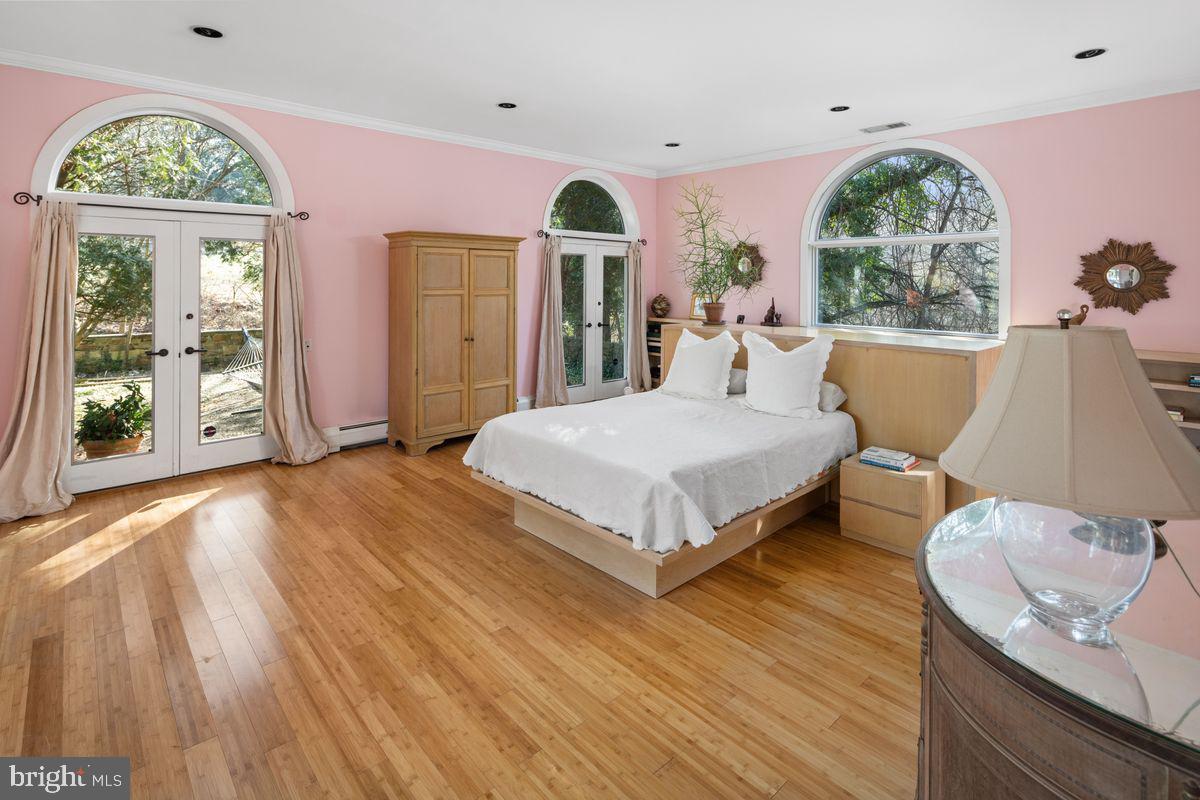 145 East Bells Mill Road Philadelphia, PA 19118 - Photo 23 of 38 a bedroom with a bed and window
