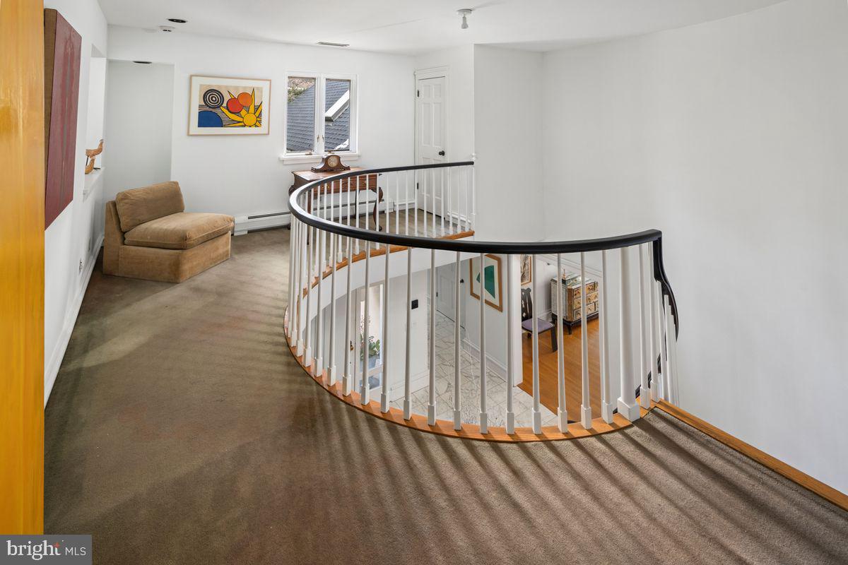 145 East Bells Mill Road Philadelphia, PA 19118 - Photo 27 of 38 a view of entryway livingroom and hall with wooden floor