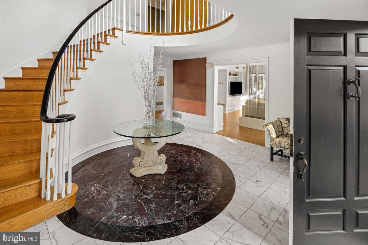 145 East Bells Mill Road Philadelphia, PA 19118 - Photo 3 of 38 a view of a livingroom with furniture and entryway