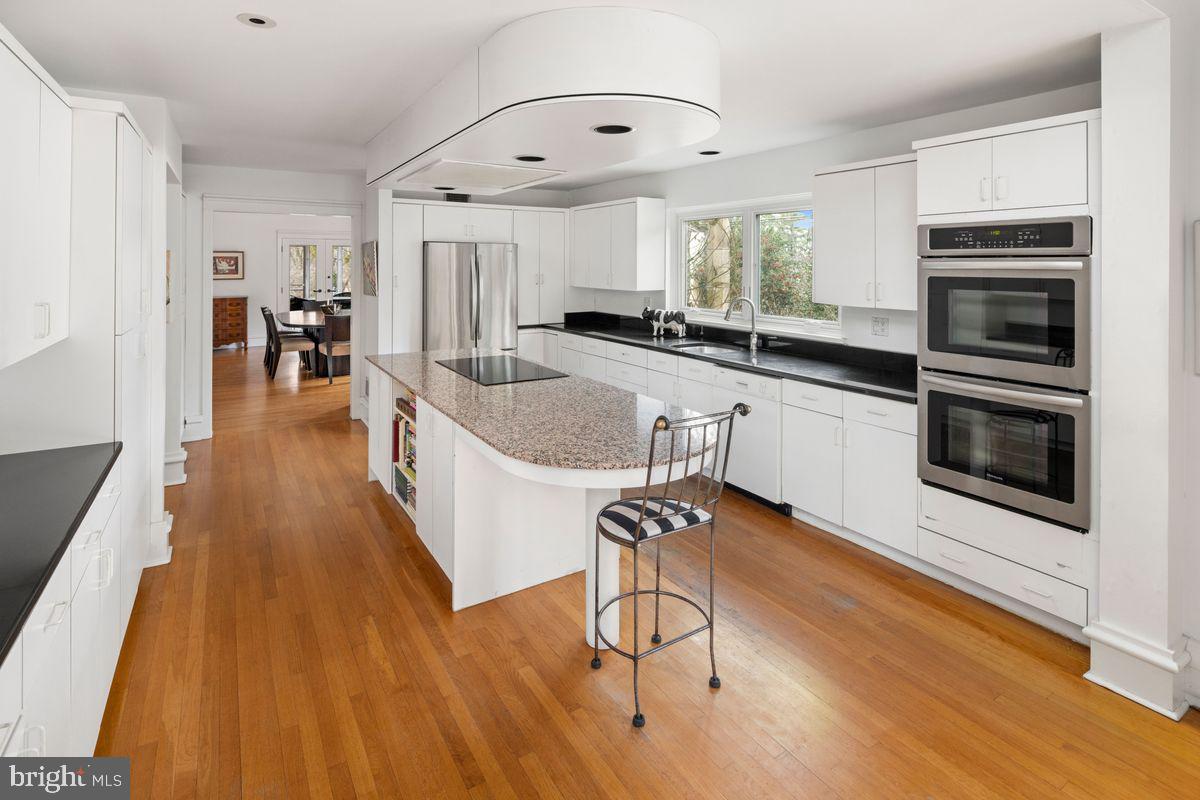 145 East Bells Mill Road Philadelphia, PA 19118 - Photo 10 of 38 a kitchen with stainless steel appliances granite countertop a stove a sink and a refrigerator