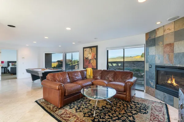 a room with furniture and flat screen tv