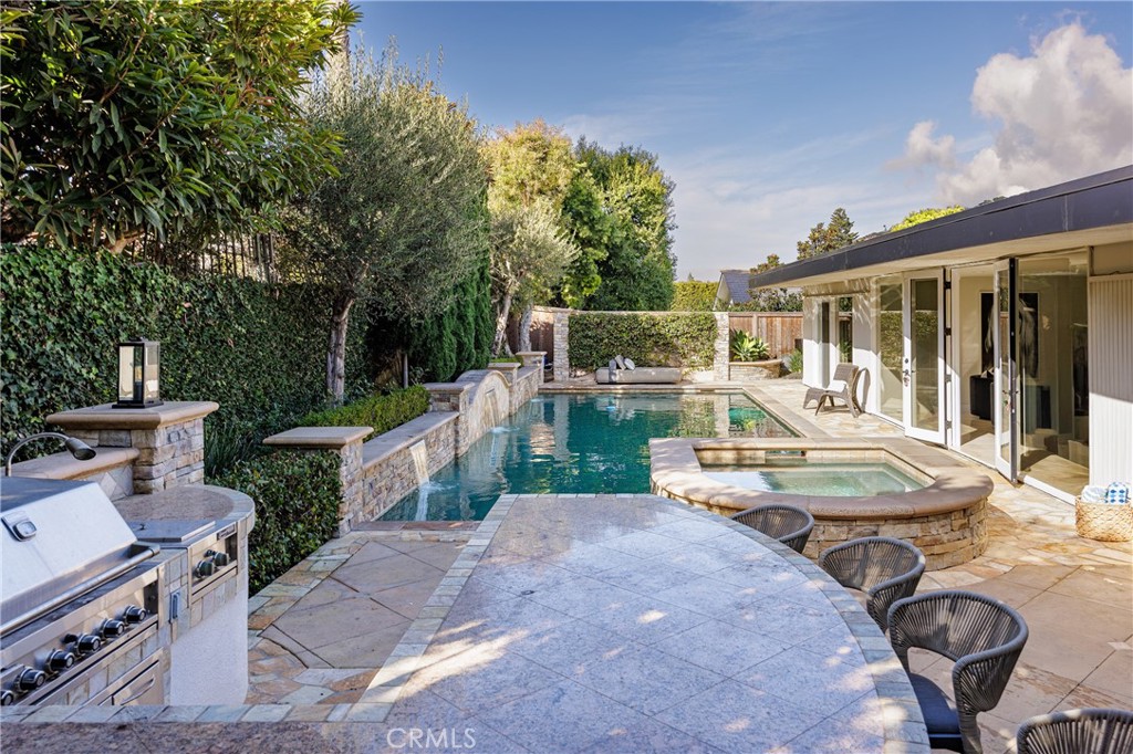 147 Monarch Bay Drive Dana Point, CA 92629 - Photo 13 of 18 a view of a patio with table and chairs with wooden floor and fence