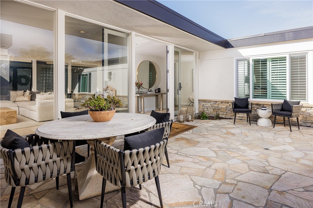 147 Monarch Bay Drive Dana Point, CA 92629 - Photo 16 of 18 a view of a dining room with furniture and window