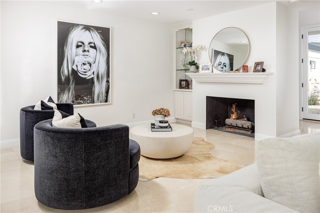 147 Monarch Bay Drive Dana Point, CA 92629 - Photo 3 of 18 a living room with furniture and a fireplace