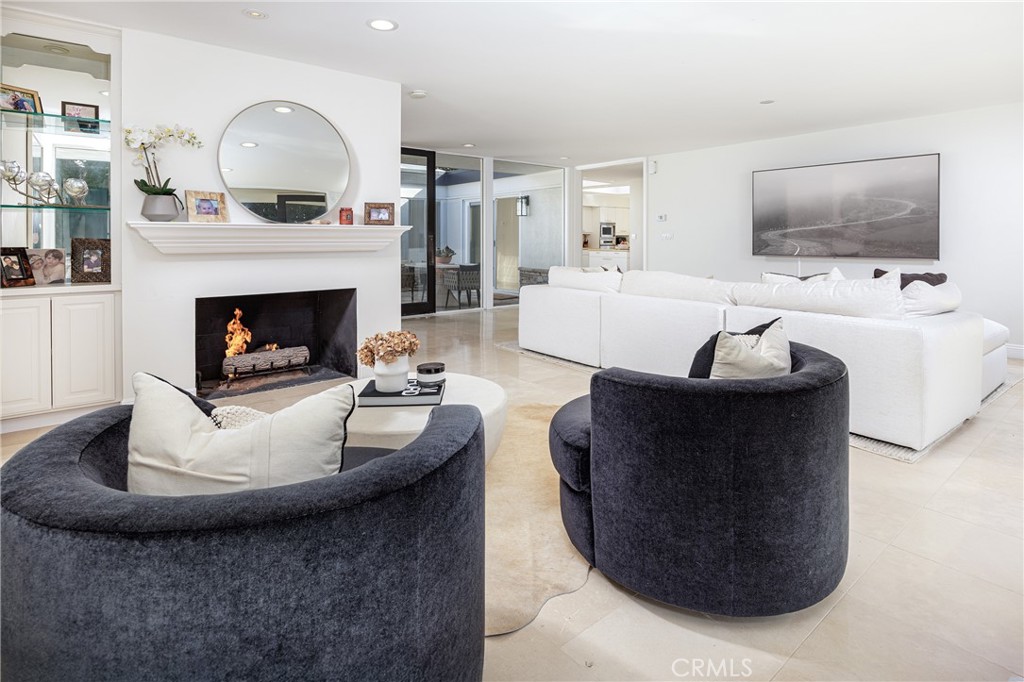 147 Monarch Bay Drive Dana Point, CA 92629 - Photo 6 of 18 a living room with furniture and a fireplace