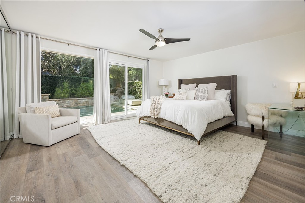 147 Monarch Bay Drive Dana Point, CA 92629 - Photo 7 of 18 a bedroom with a large bed and a couch