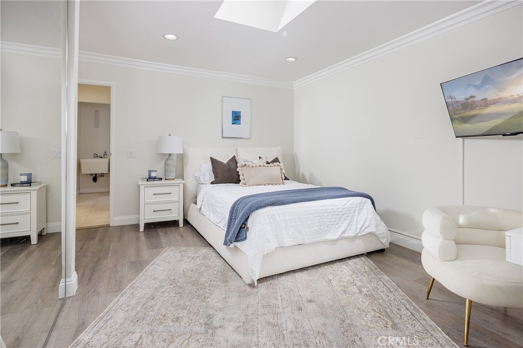 147 Monarch Bay Drive Dana Point, CA 92629 - Photo 10 of 18 a bedroom with a bed and a couch