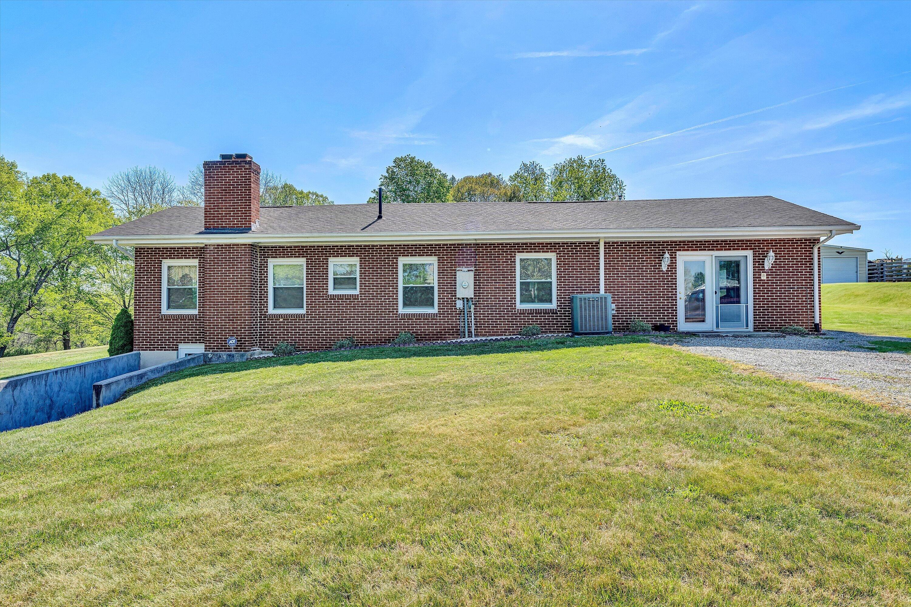 3673 Mt Zion Road Blacksburg, VA 24060 - Photo 49 of 51 a front view of a house with a garden