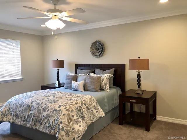 a bedroom with a bed and a lamp