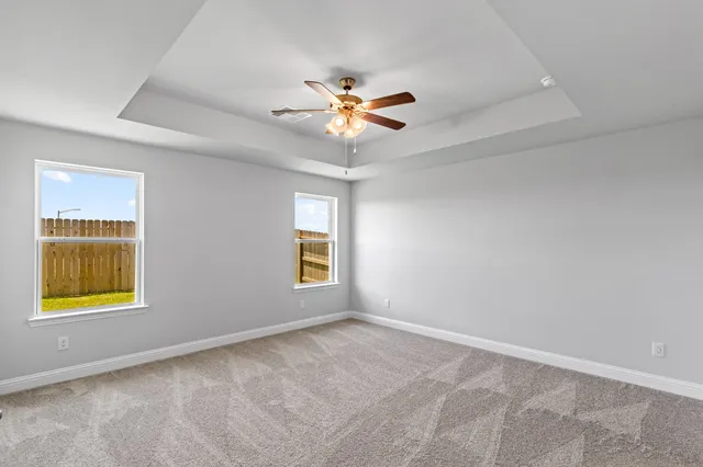 a bathroom with a granite countertop sink a light fixture and a mirror