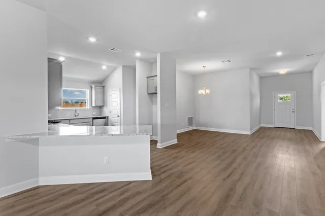 a view of kitchen with wooden floor