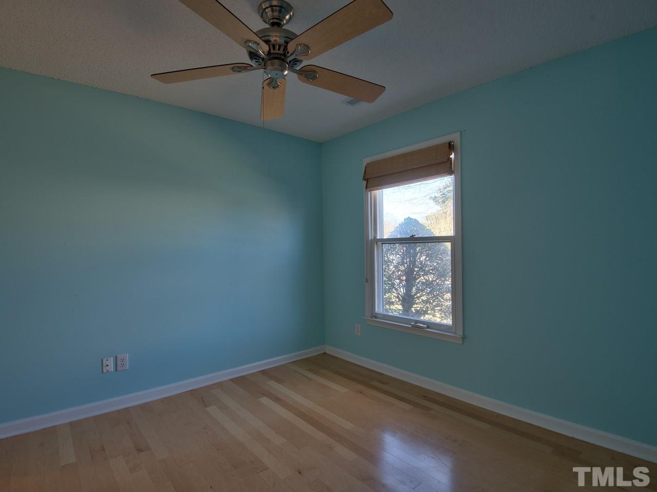 2740 Cottage Circle Raleigh, NC 27613 - Photo 14 of 25 an empty room with windows and fan