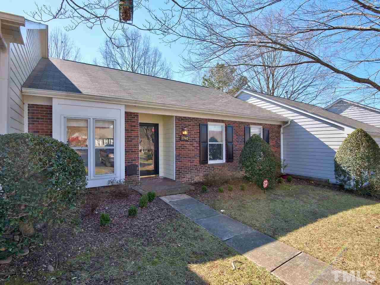 2740 Cottage Circle Raleigh, NC 27613 - Photo 25 of 25 a front view of a house with garden