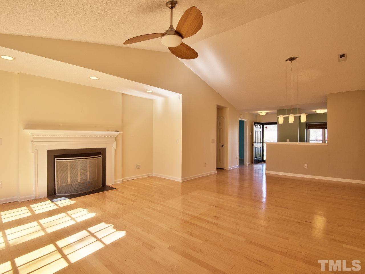 2740 Cottage Circle Raleigh, NC 27613 - Photo 10 of 25 a view of an empty room with window and wooden floor