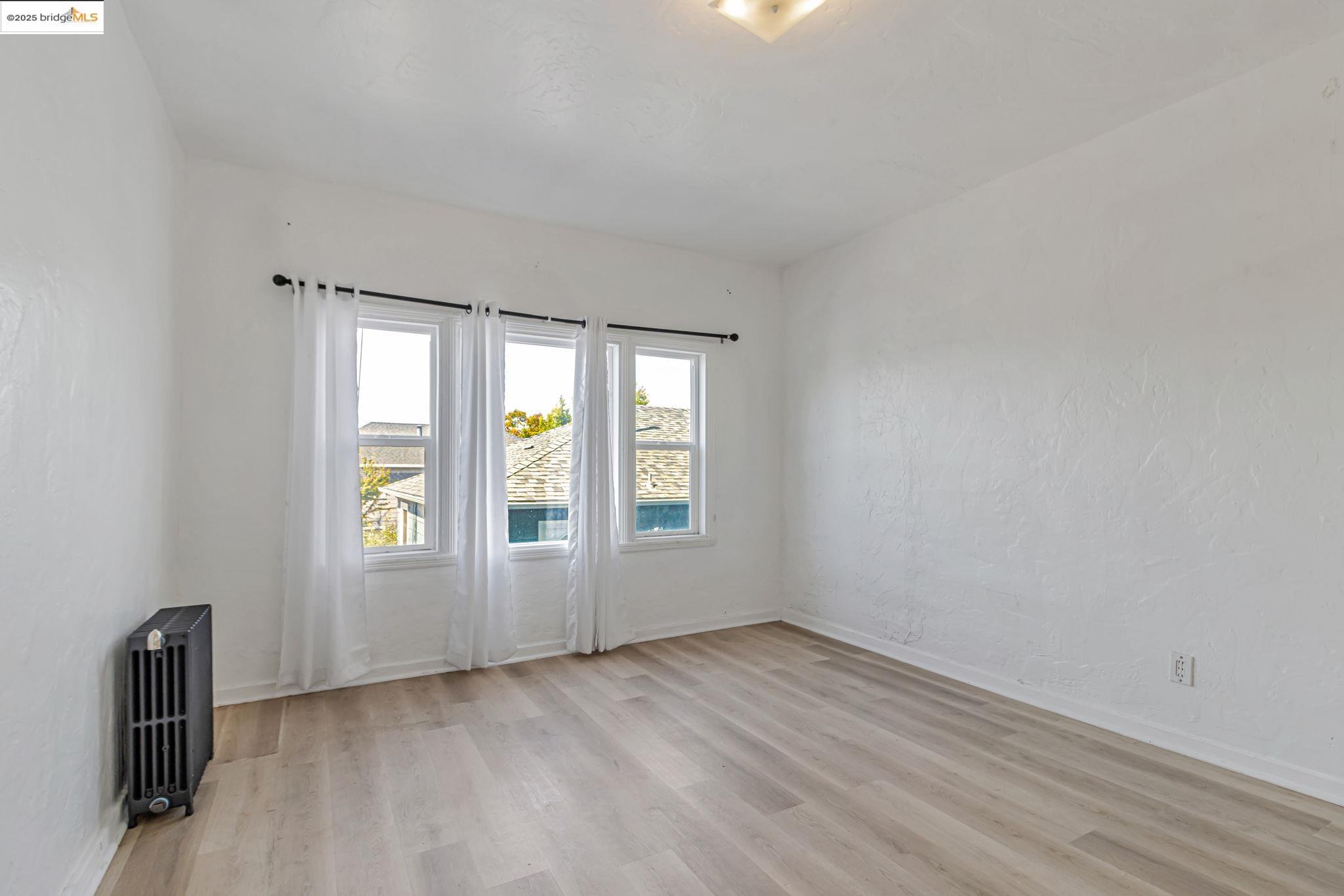 1360 Berkeley Way Berkeley, CA 94702 - Photo 11 of 35 an empty room with windows