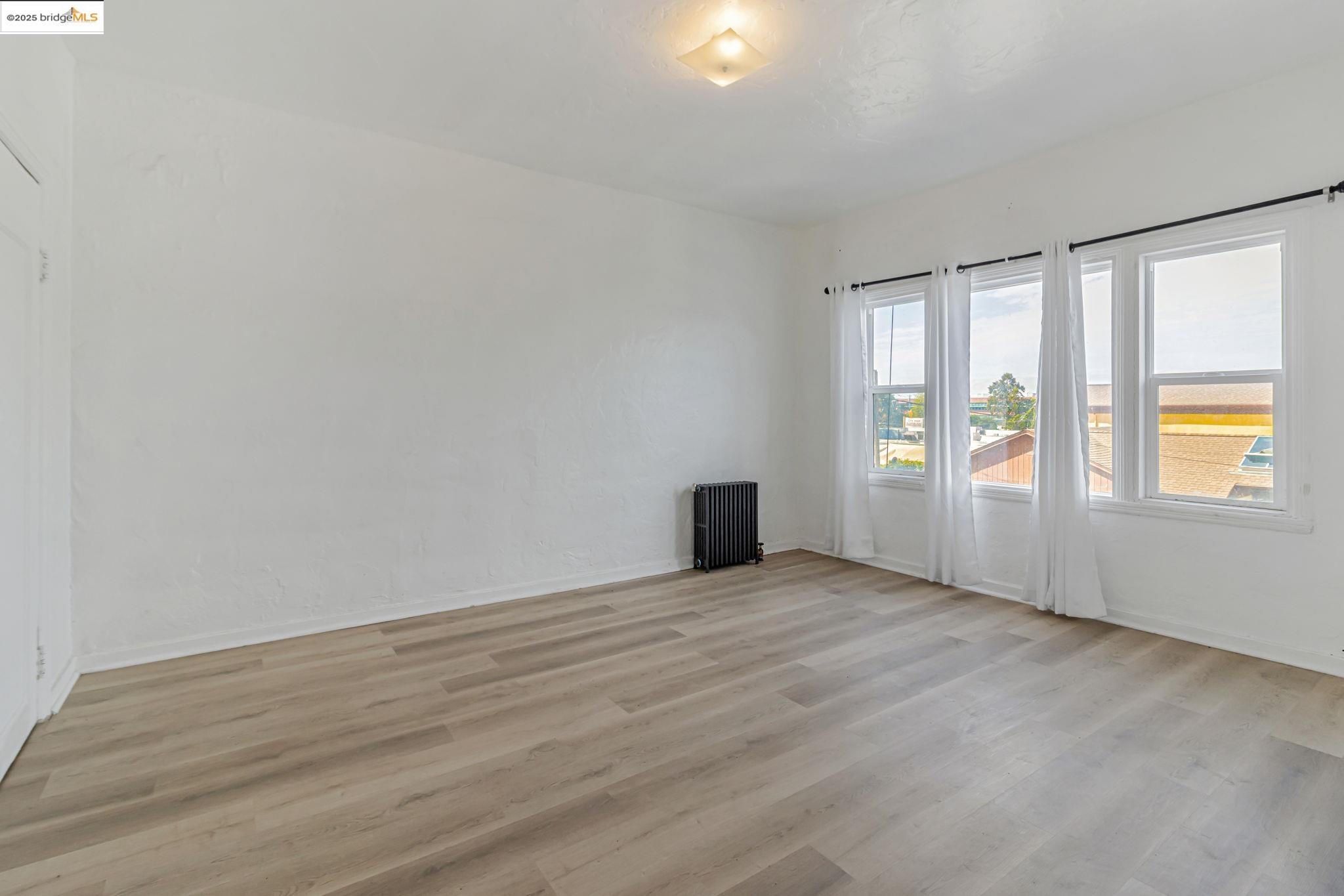 1360 Berkeley Way Berkeley, CA 94702 - Photo 12 of 35 a view of an empty room with a window
