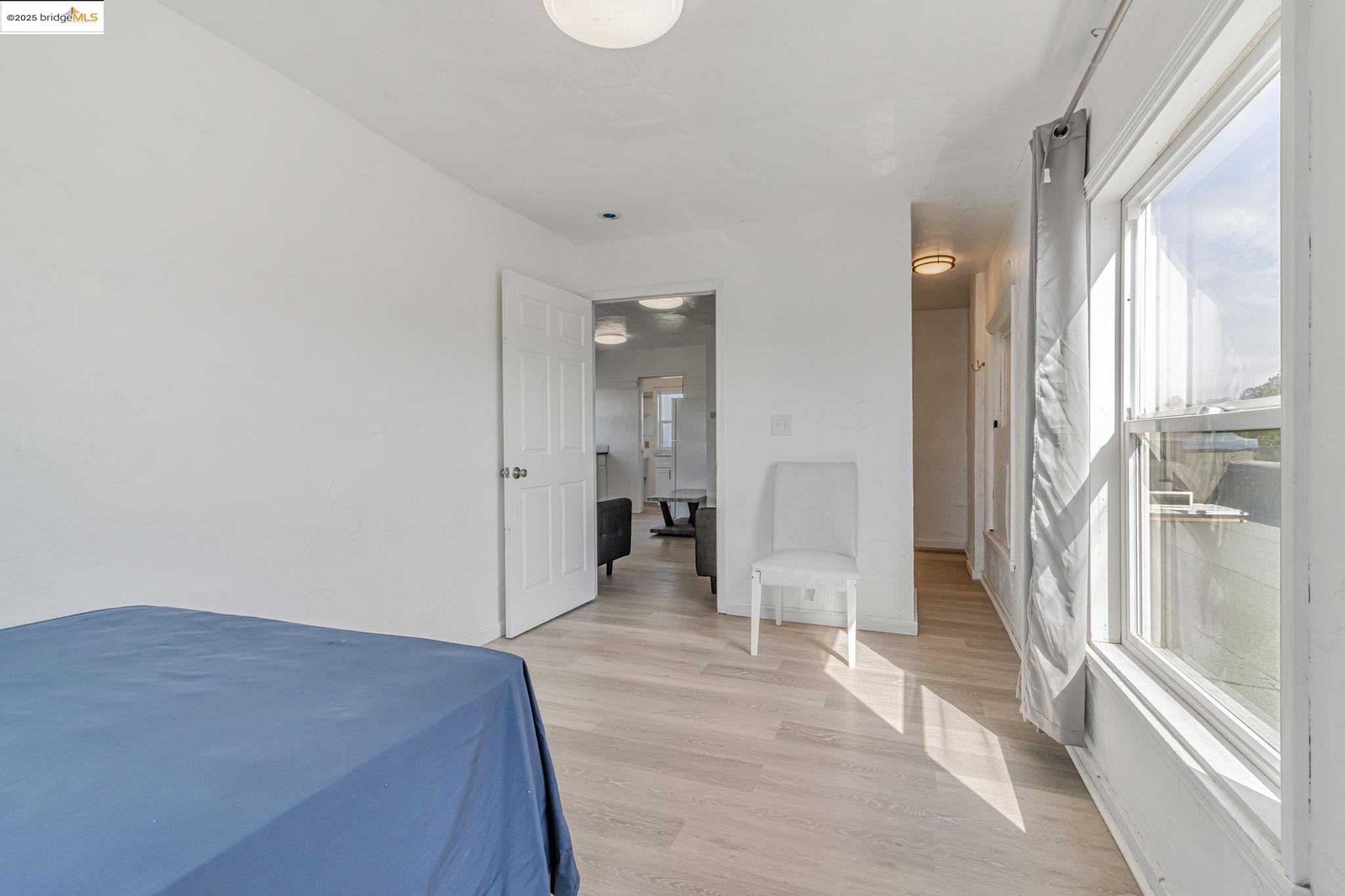 1360 Berkeley Way Berkeley, CA 94702 - Photo 14 of 35 a view of empty room with wooden floor and window