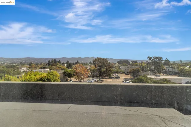an aerial view of residential building and trees