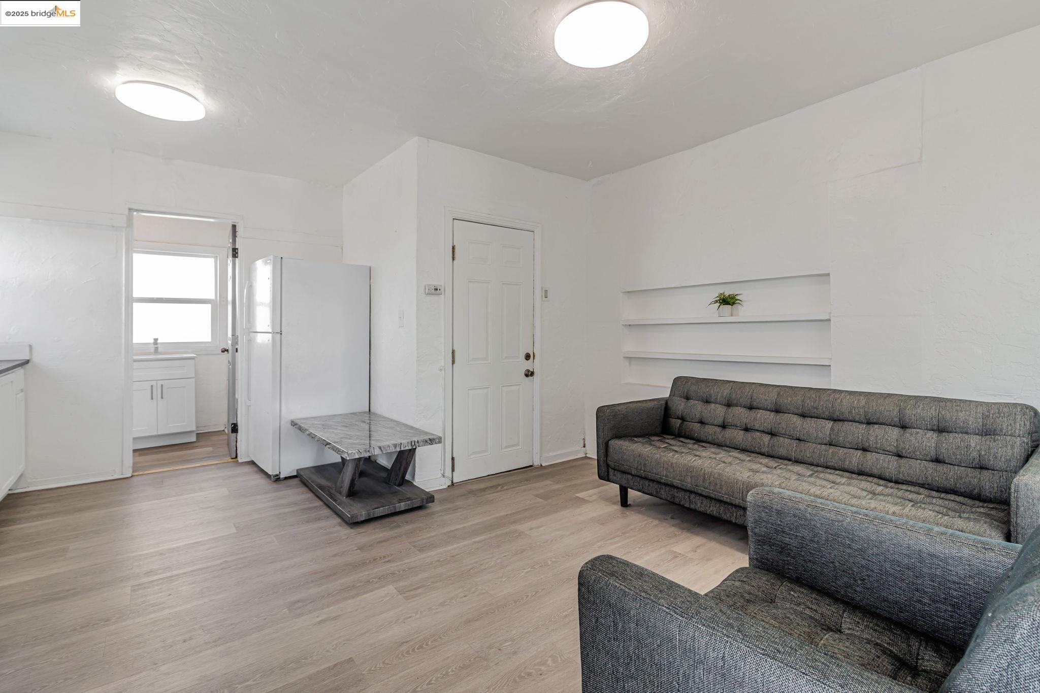 1360 Berkeley Way Berkeley, CA 94702 - Photo 29 of 35 a living room with furniture and wooden floor