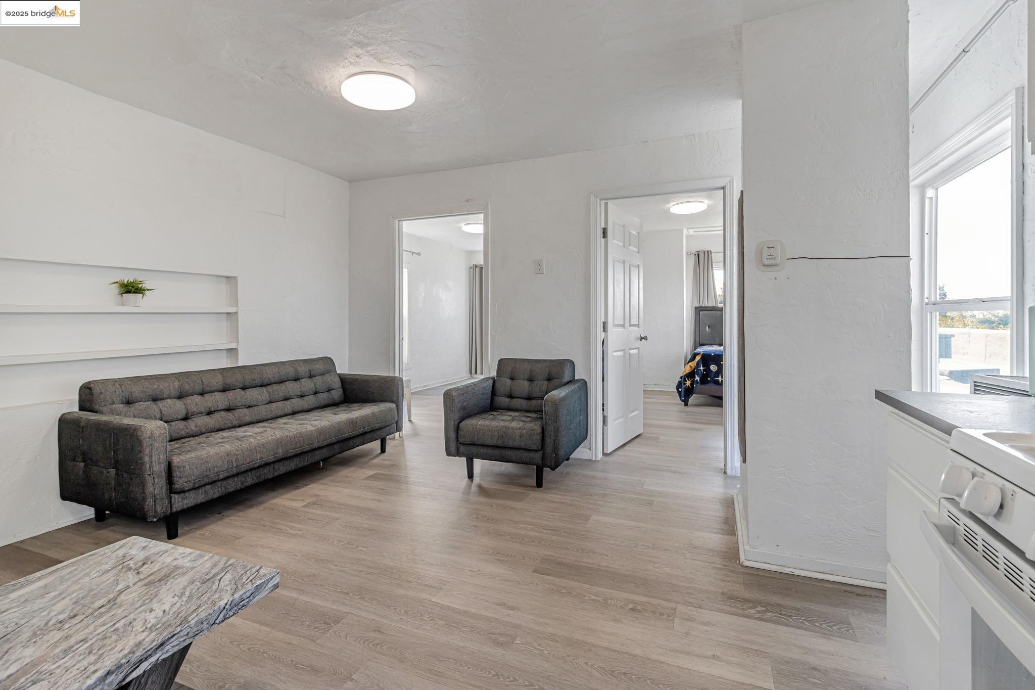 1360 Berkeley Way Berkeley, CA 94702 - Photo 30 of 35 a living room with furniture and a couch