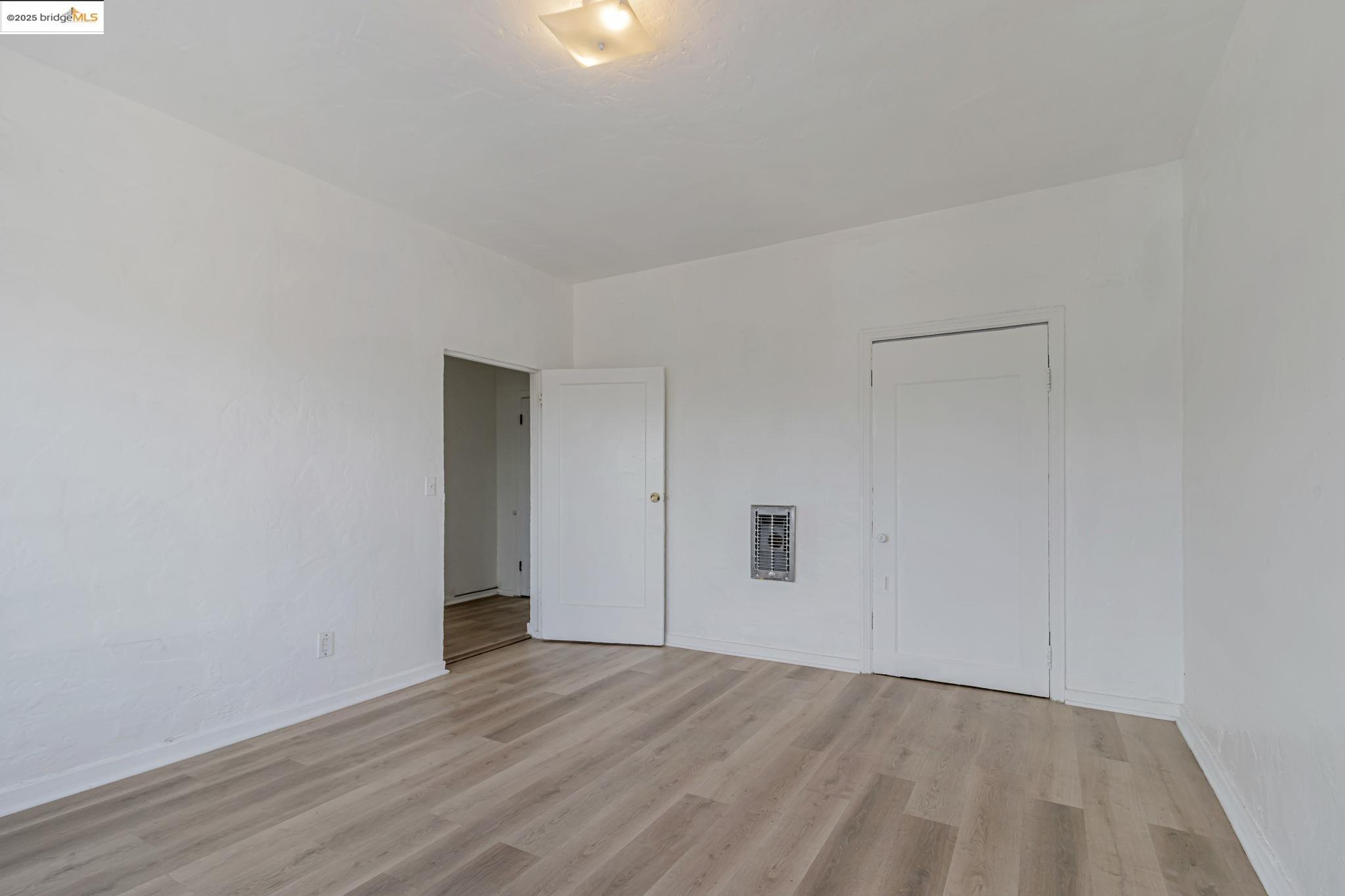 1360 Berkeley Way Berkeley, CA 94702 - Photo 10 of 35 a view of an empty room with wooden floor